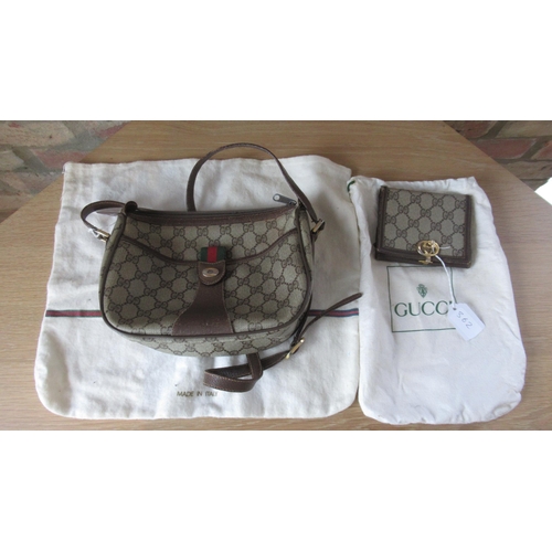 362 - A vintage Gucci handbag with Gucci monogram throughout with leather strap - 25cm x 18cm - together w... 