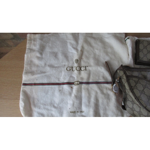 362 - A vintage Gucci handbag with Gucci monogram throughout with leather strap - 25cm x 18cm - together w... 