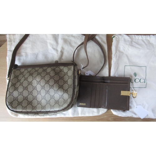 362 - A vintage Gucci handbag with Gucci monogram throughout with leather strap - 25cm x 18cm - together w... 