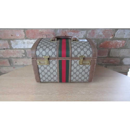 364 - A vintage Gucci vanity case with Gucci monogram throughout with leather fittings - 32cm x 23cm x 22c... 