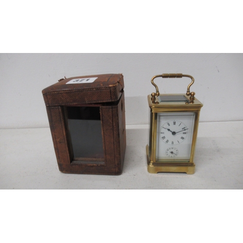 371 - A brass cased alarm carriage clock with alarm - approx 9cm x 5cm x 6cm - working in saleroom - with ... 