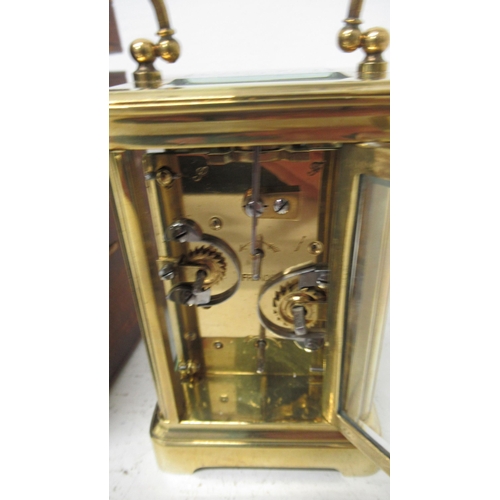 371 - A brass cased alarm carriage clock with alarm - approx 9cm x 5cm x 6cm - working in saleroom - with ... 