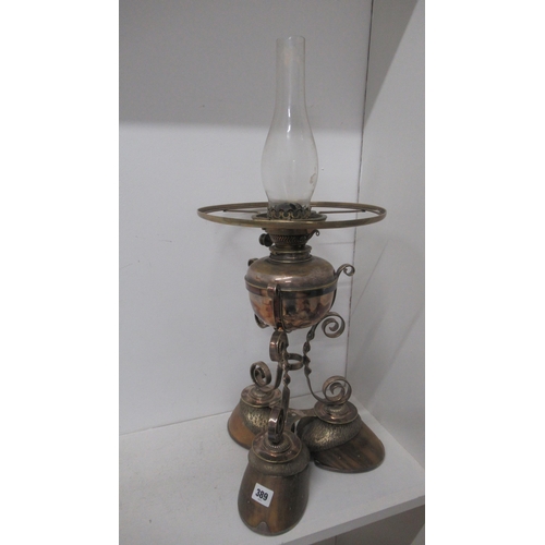 389 - An unusual oil lamp mounted on three hoof feet