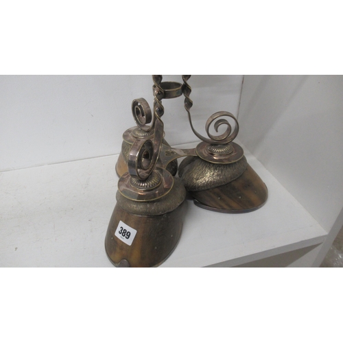 389 - An unusual oil lamp mounted on three hoof feet