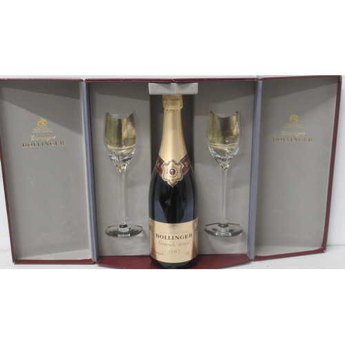 393 - A bottle of Bollinger Grand Anne 1982 in Harrods presentation box with a pair of flutes