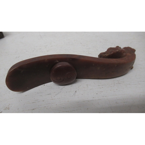 399 - A brown Jade Ruyi Sceptre on a wooden stand - Width 12cm