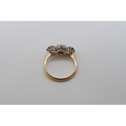 4 - An 18ct yellow gold and platinum three stone diamond ring - diamond weight approx 2.25ct, centre sto... 