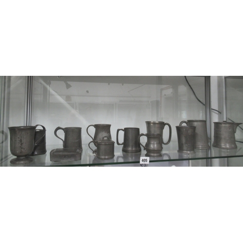 405 - Twelve items of antique Pewter, mostly mugs