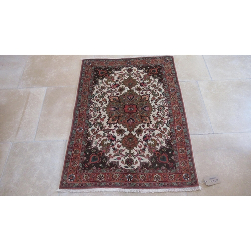 496A - A hand knotted woollen Tabriz rug - 1.40m x 1.02m