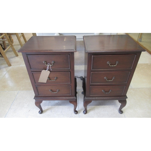 511 - A pair of early 20th century mahogany three drawer bedside chests on cabriole legs - restored condit... 