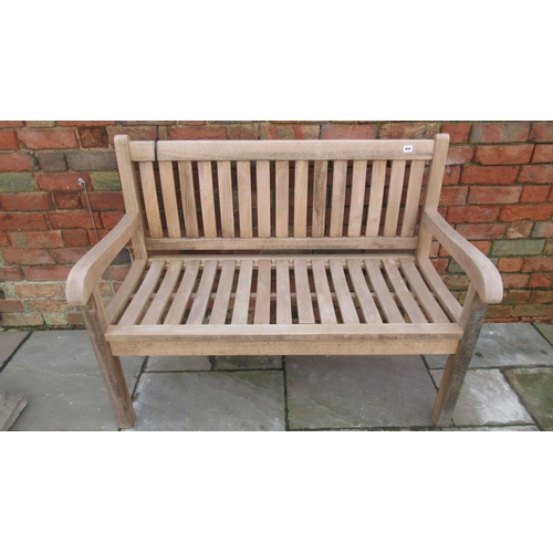 514 - A weathered teak garden bench, sound condition and well made, 120cm wide