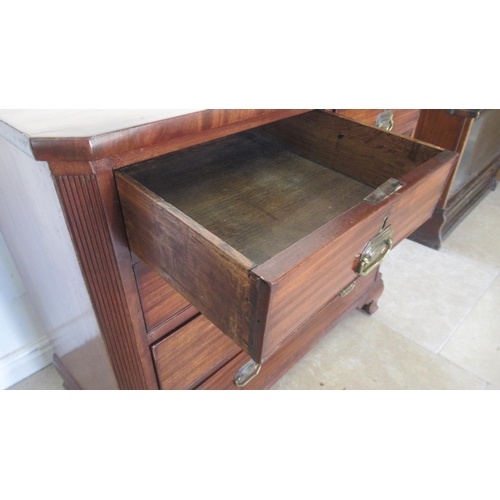 521 - A Georgian mahogany chest with canted corners and two short over three long drawers on bracket feet,... 