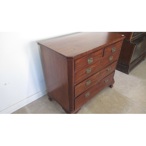 521 - A Georgian mahogany chest with canted corners and two short over three long drawers on bracket feet,... 