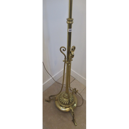 536 - A good quality brass lamp with adjustable height on three outswept legs, 190cm high