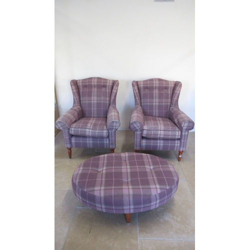 554 - A pair of Laura Ashley wing armchairs and a matching footstool in good condition