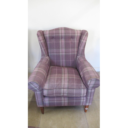 554 - A pair of Laura Ashley wing armchairs and a matching footstool in good condition