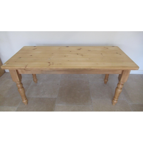 566 - A good quality modern pine table on turned legs, 170cm wide x 76cm x 76cm high