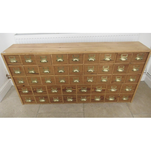 567 - A 19th century pine seed cabinet with 45 drawers with brass cup handles, well made with dovetailed d... 