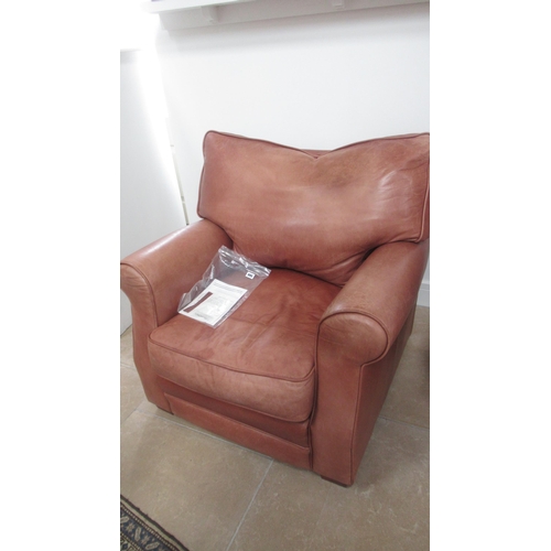 568 - A Collins and Hayes tan leather settee and matching armchair