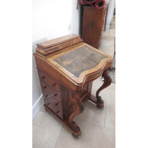 569 - A Victorian burr walnut Davenport with four drawers, sloped writing space and top mounted storage un... 