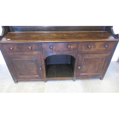 575 - A good 18th/19th century oak dresser - the top with three shelves and wide back boards over the pot ... 