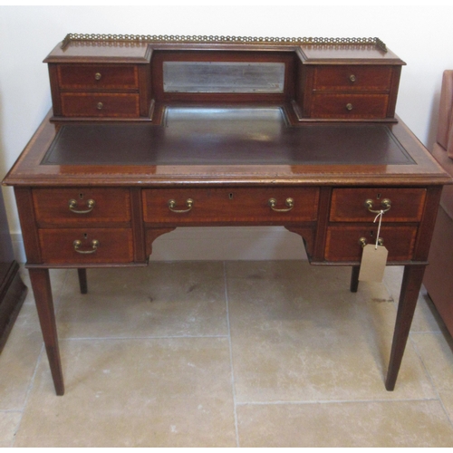 584 - An Edwardian mahogany and satinwood crossbanded inlaid five drawer desk with mirrored upper section ... 