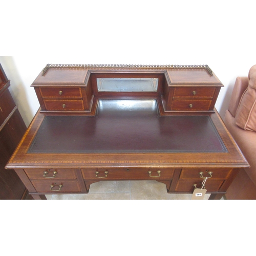 584 - An Edwardian mahogany and satinwood crossbanded inlaid five drawer desk with mirrored upper section ... 