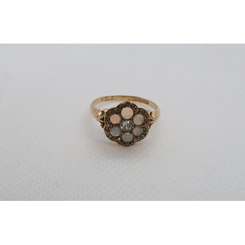 66 - An 18ct (hallmarked) yellow gold diamond and opal daisy cluster ring size R/S - weight approx 3.6 gr... 