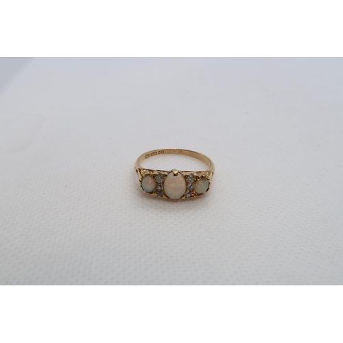 68 - An 18ct yellow gold graduated opal and diamond accent bridge ring size R - weight approx 3.7 grams