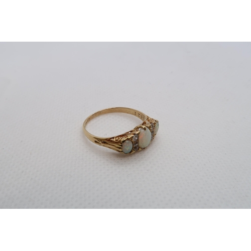 68 - An 18ct yellow gold graduated opal and diamond accent bridge ring size R - weight approx 3.7 grams