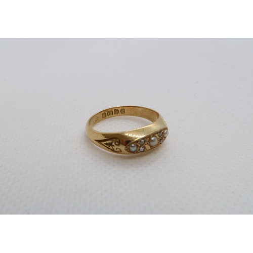 72 - An 18ct (hallmarked) yellow gold ring with pearls and diamond accent - ring size N/O - weight approx... 