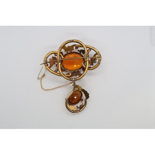 77 - A large and ornate Victorian pinchbeck citrine brooch - 8cm x 6cm