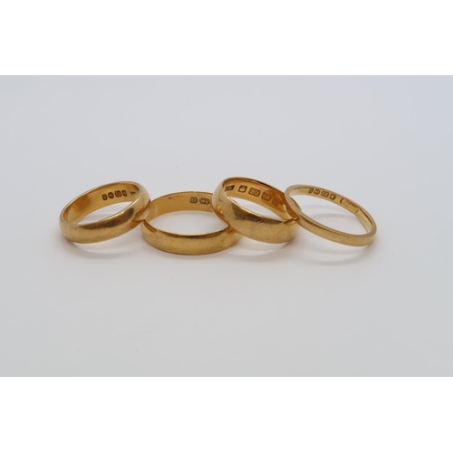 82 - Four 22ct (hallmarked) yellow gold wedding bands sizes N(bent) I, Q/R, I/J - approx total weight 16 ... 