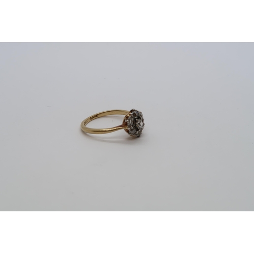 83 - An 18ct yellow gold (hallmarked) diamond daisy cluster ring set with old mine cut diamonds, size K, ... 