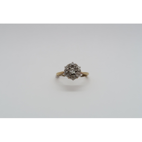 83 - An 18ct yellow gold (hallmarked) diamond daisy cluster ring set with old mine cut diamonds, size K, ... 