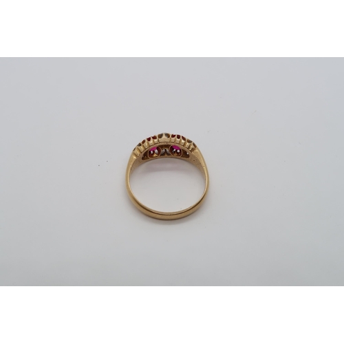 88 - An 18ct yellow gold ruby and diamond bridge ring, size O, approx 3.9 grams