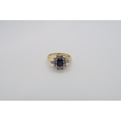 93 - An 18ct yellow gold hallmarked sapphire and diamond cluster ring, size N/O, approx 5.3 grams