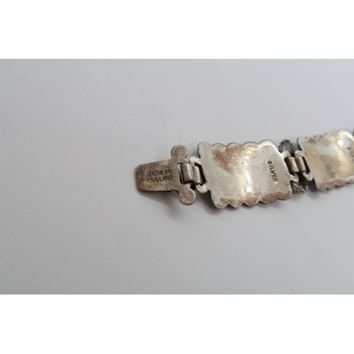 94 - A Harmony silver and enamel bracelet, six rectangular links with floral decoration with blue and whi... 