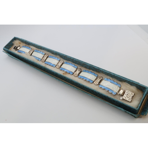 94 - A Harmony silver and enamel bracelet, six rectangular links with floral decoration with blue and whi... 