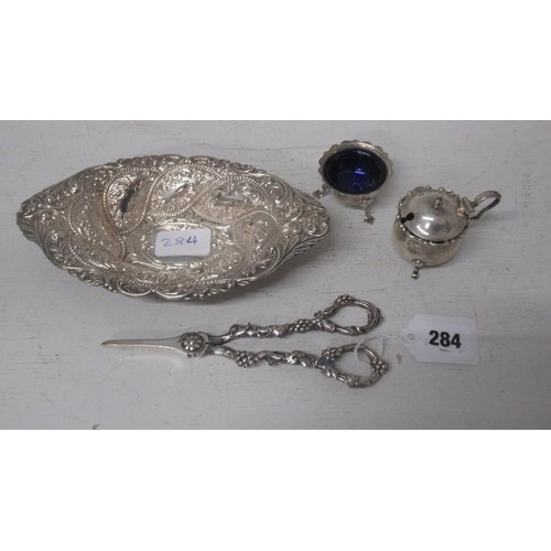 284 - A pair of silver grape scissors together with an Edwardian silver bon bon dish and a silver salt and... 