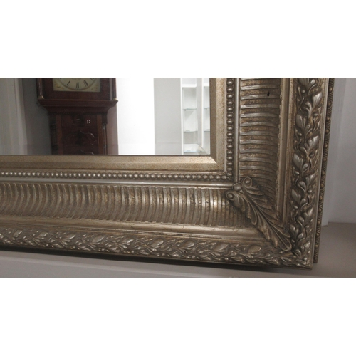 526 - A good quality large gilt framed mirror with bevelled glass - in good condition - 123cm x 93cm