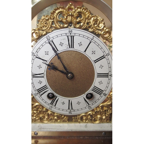 565 - A Lenzkirch mahogany architectural 8 day mantel clock with brass dial on four brass feet with carry ... 