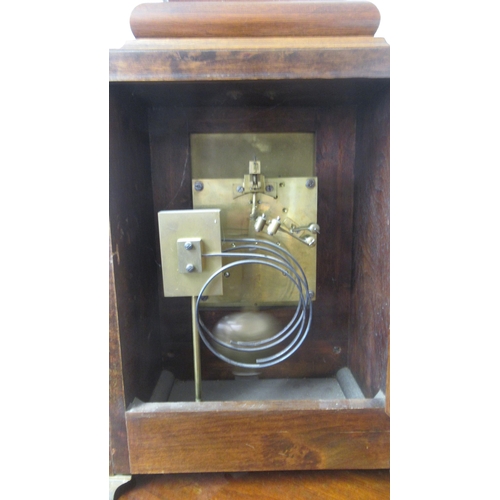 565 - A Lenzkirch mahogany architectural 8 day mantel clock with brass dial on four brass feet with carry ... 