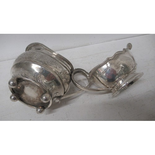 283 - A George IV silver cream jug London 1820 - 10cm - together with a silver sauce boat, Sheffield 1934 ... 