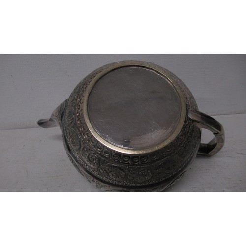 298 - An Indian silver three piece tea set, approx 22.6 troy oz