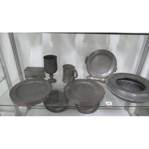 417 - Seven antique Pewter items