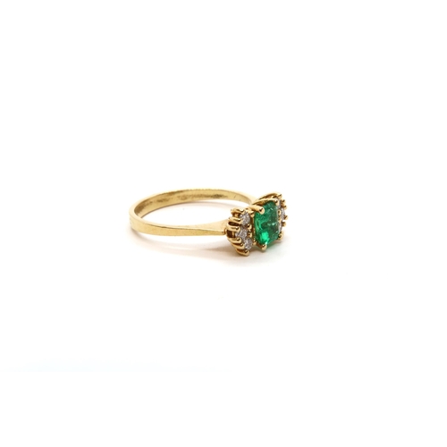 13 - An 18ct yellow gold (tested) emerald and diamond ring, emerald has natural inclusions, diamonds brig... 