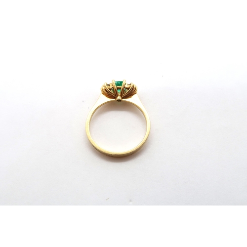 13 - An 18ct yellow gold (tested) emerald and diamond ring, emerald has natural inclusions, diamonds brig... 