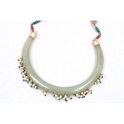 15 - A 'Mughal' style Jade and precious stone necklace, Celadon Jade arc inlaid with yellow gold and set ... 