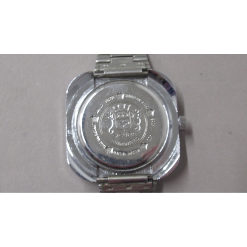 292 - SICURA. Globetrotter 70's world timer. Manual 4 hands and sweep seconds. 40mm. Outer numbered bi dir... 